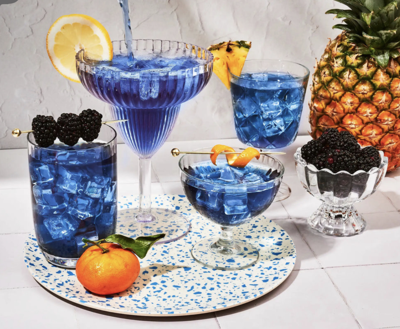 Butterfly pea flower drinks with blackberries and pineapple