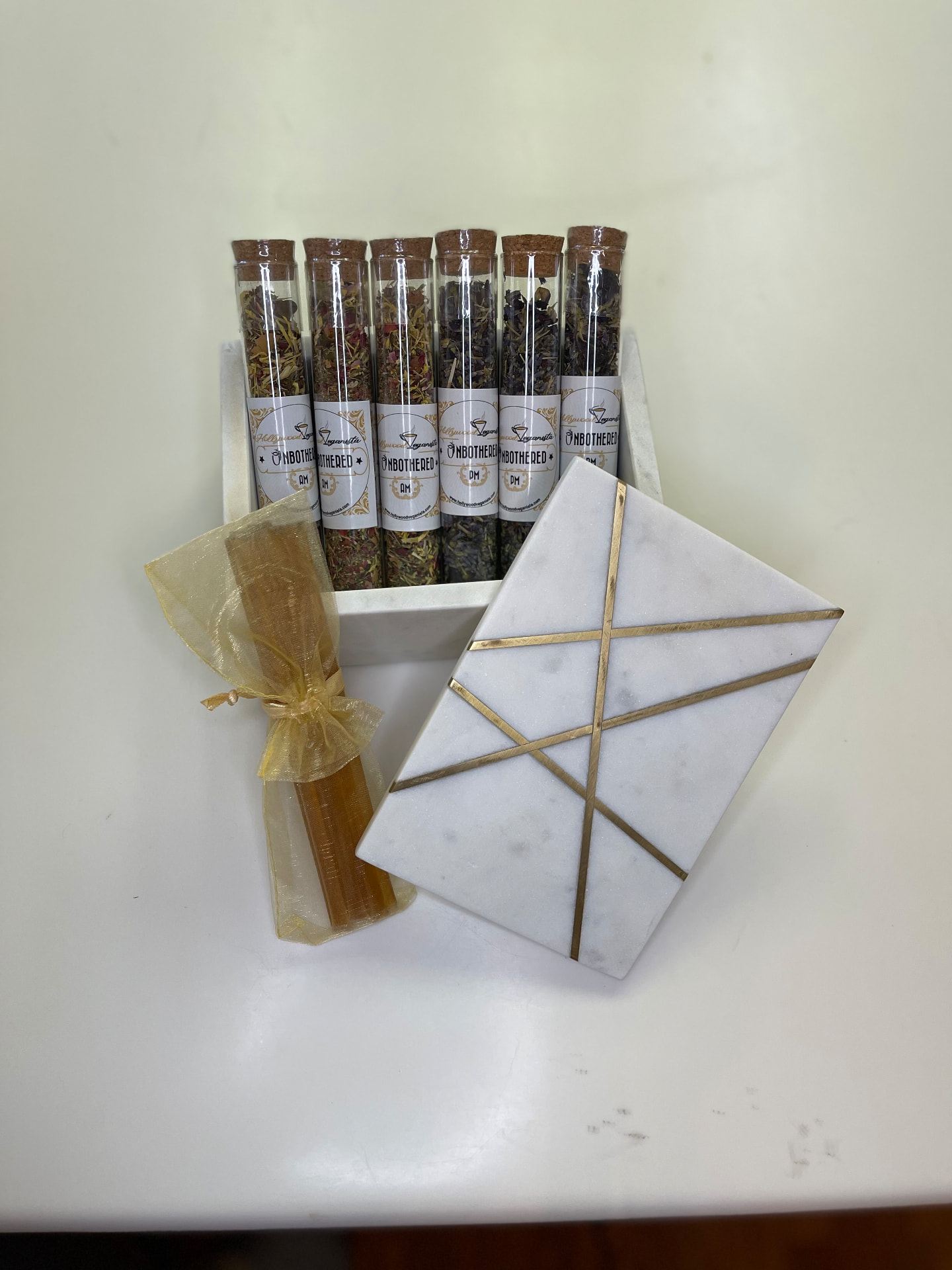 Unbothered AM and PM tea blends in corked glass tubes
